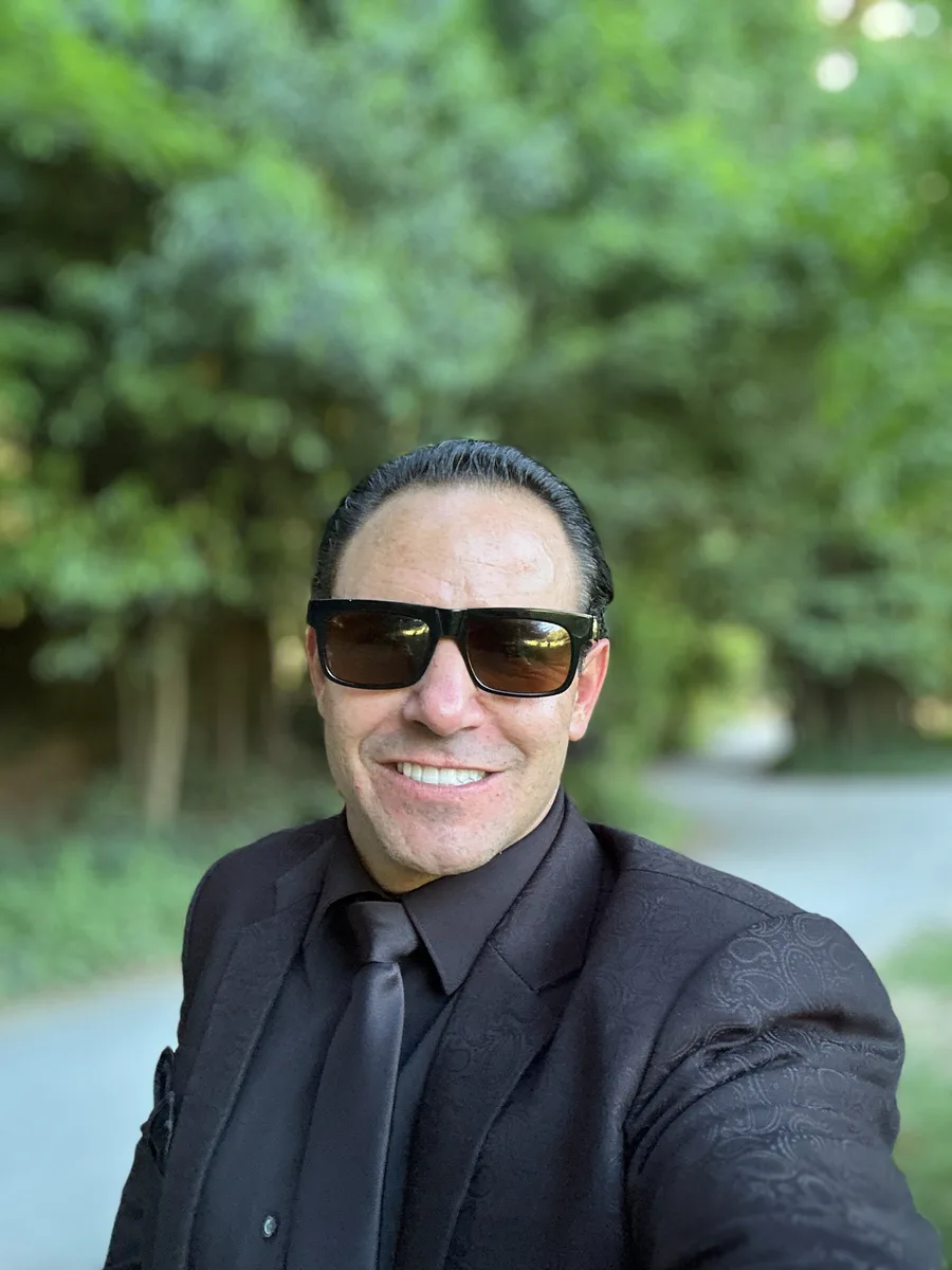 Michael Jannicelli smiling in a black suit